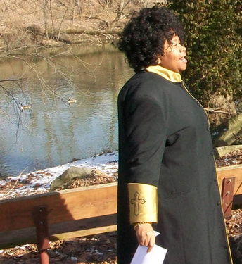 Reverend Monica Beasley-Martin delivering sermon on the banks of the Mahoning, Youngstown, Ohio, February 10, 2013.
